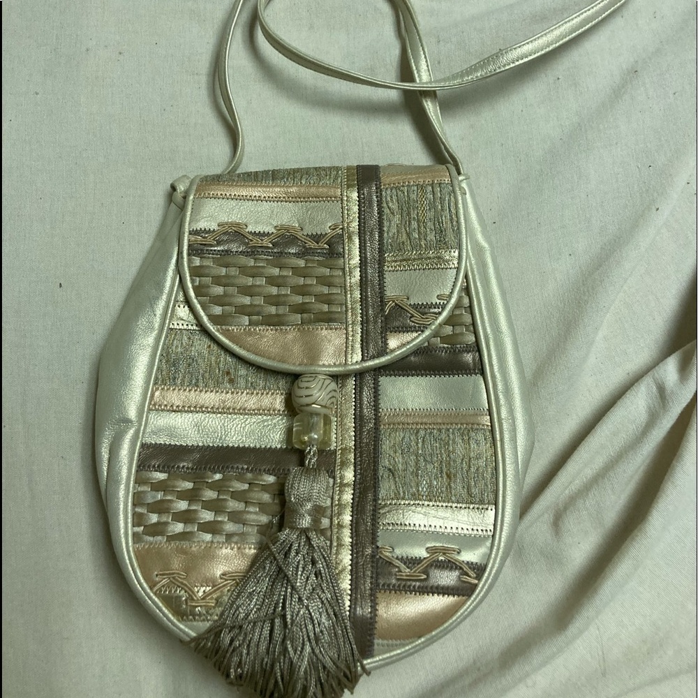 Stylish shoulder bag with beautiful front panel and adjustable long strap.